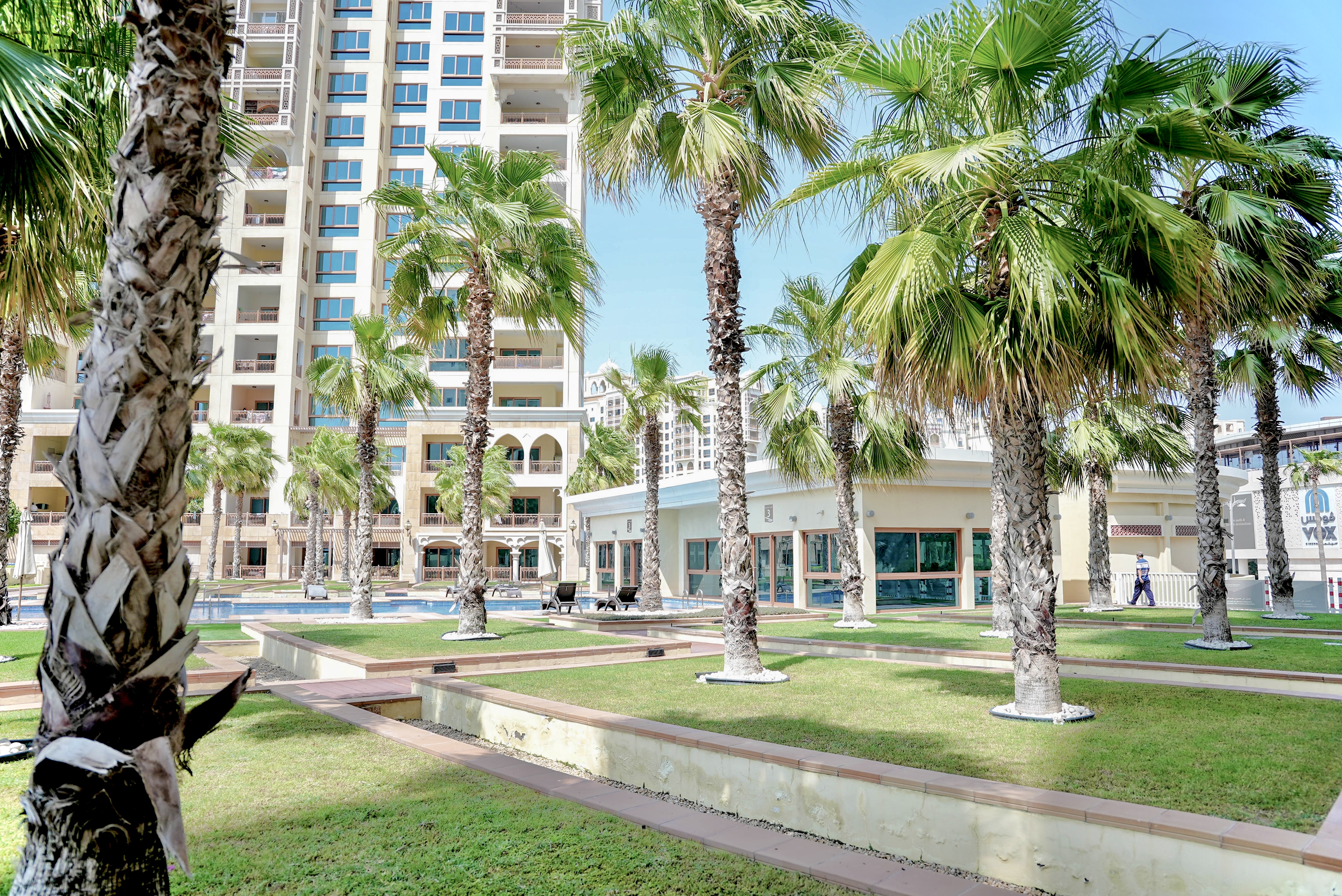Palm-lined grounds with a resort pool on your doorstep